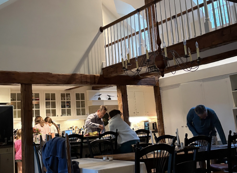 My family gathered in the timber-beamed kitchen, cooking and setting the table